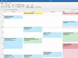 Outlook calendar weekly view with scheduled meetings and events.
